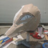 Once I am satisfied with the paper sculpt, I coat it in rondo, a mix of fiberglass resin and bondo body filler. This makes it rigid and easier to make a pattern from.