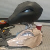 The mask is now glued together using barge cement. Note it isn't quite right, this is due to moving the pattern from thin paper to thick foam. A little cutting and sanding will fix this.